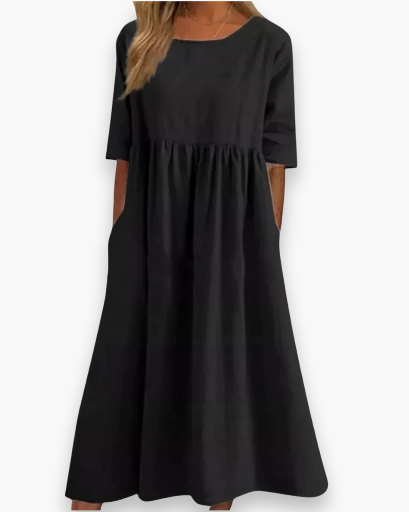 "Robe midi élégante et confortable pour femme, coupe fluide et détails soignés dans diverses couleurs disponibles."