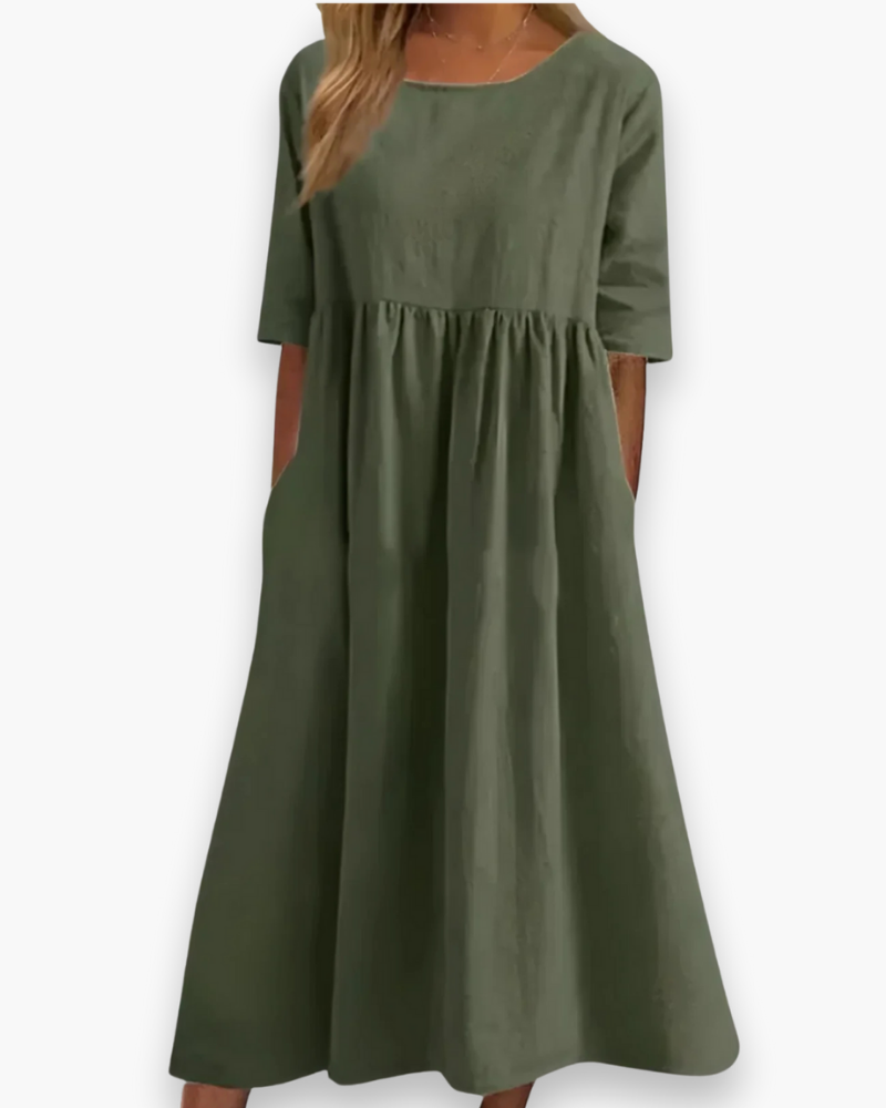 "Robe midi élégante et confortable pour femme, coupe fluide et détails soignés dans diverses couleurs disponibles."