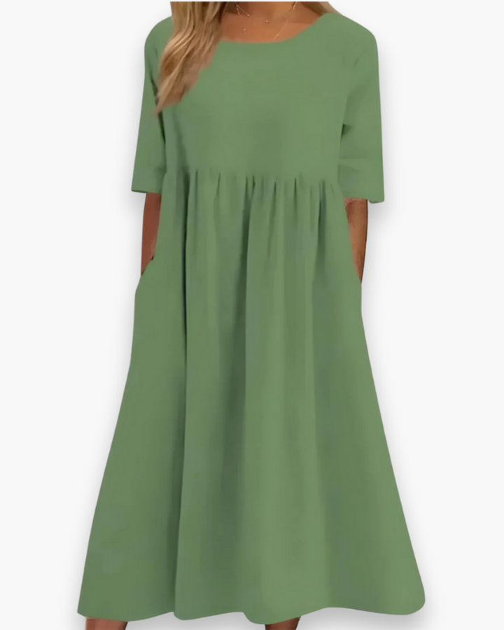 "Robe midi élégante et confortable pour femme, coupe fluide et détails soignés dans diverses couleurs disponibles."