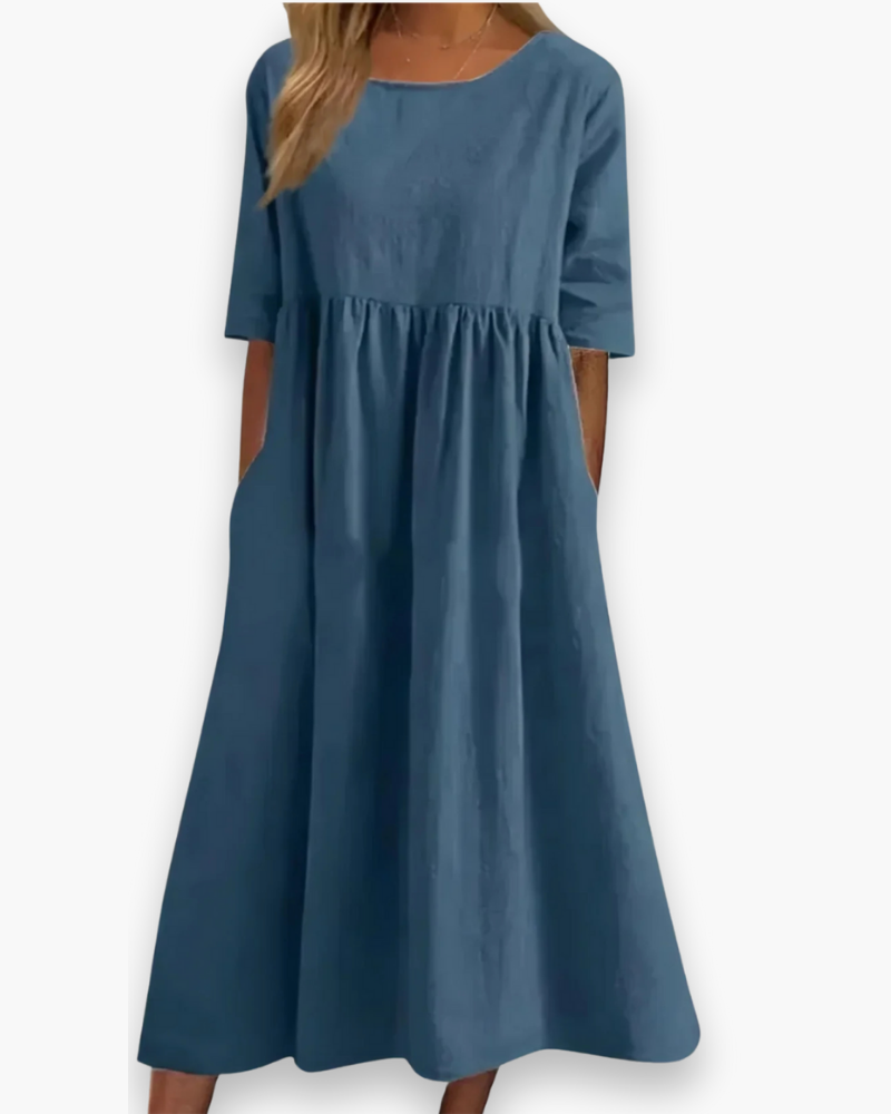 "Robe midi élégante et confortable pour femme, coupe fluide et détails soignés dans diverses couleurs disponibles."