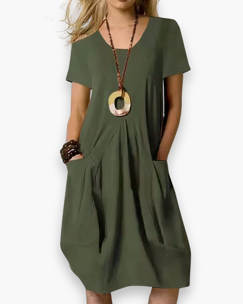 Robe midi femme élégante, ample et chic, tissu fluide avec poches, adaptable pour occasion décontractée ou sophistiquée.