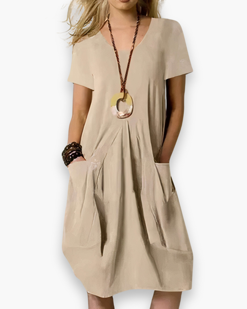 Robe midi femme élégante, ample et chic, tissu fluide avec poches, adaptable pour occasion décontractée ou sophistiquée.