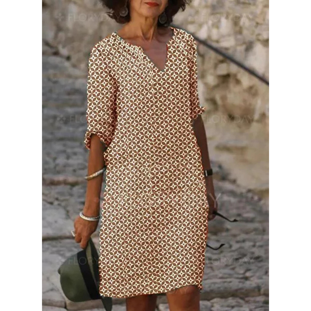 "Robe midi femme fluide et confortable pour l'été, coupe ample, tissu léger, idéale pour sorties estivales."