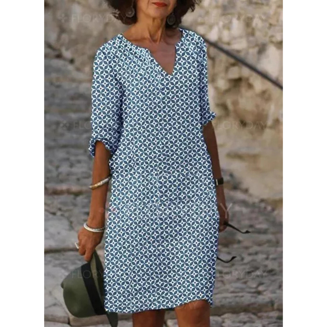 "Robe midi femme fluide et confortable pour l'été, coupe ample, tissu léger, idéale pour sorties estivales."