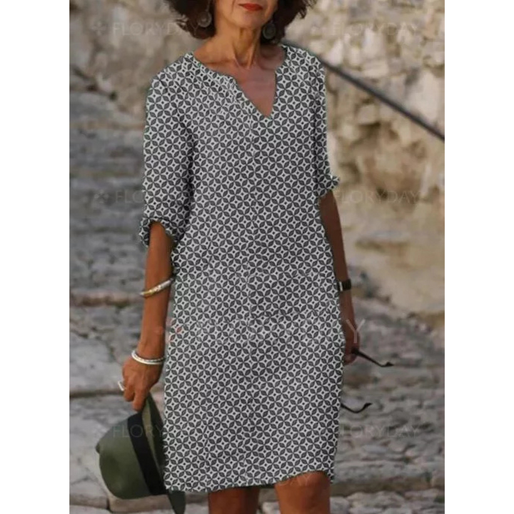 "Robe midi femme fluide et confortable pour l'été, coupe ample, tissu léger, idéale pour sorties estivales."