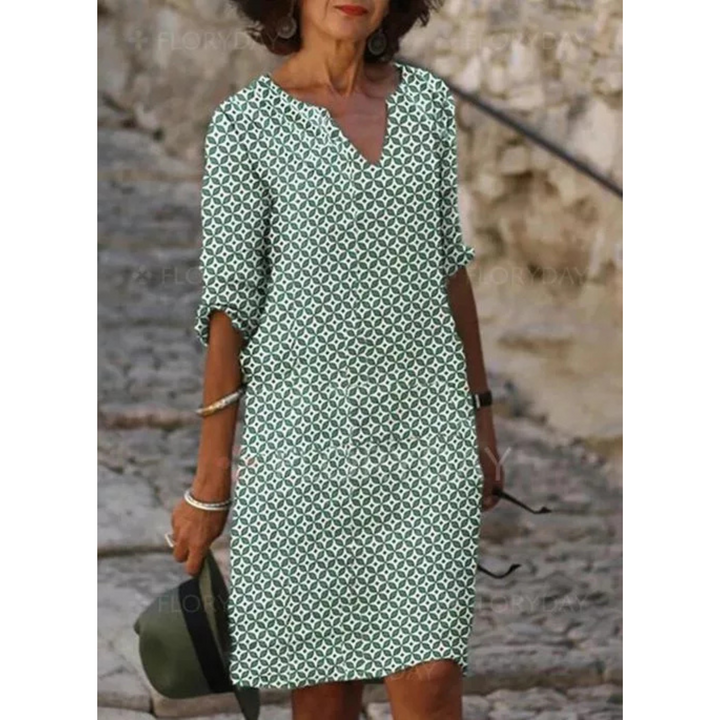 "Robe midi femme fluide et confortable pour l'été, coupe ample, tissu léger, idéale pour sorties estivales."