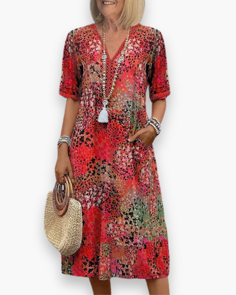"Robe midi imprimée pour femme avec coupe fluidité et motif raffiné, vue de face, élégante et chic"