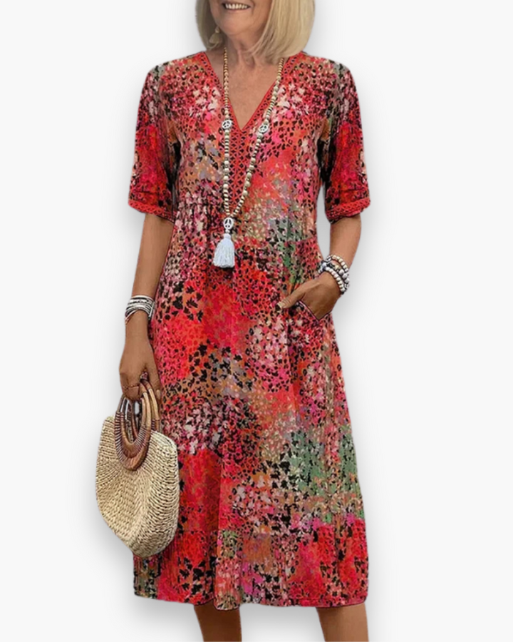 "Robe midi imprimée pour femme avec coupe fluidité et motif raffiné, vue de face, élégante et chic"