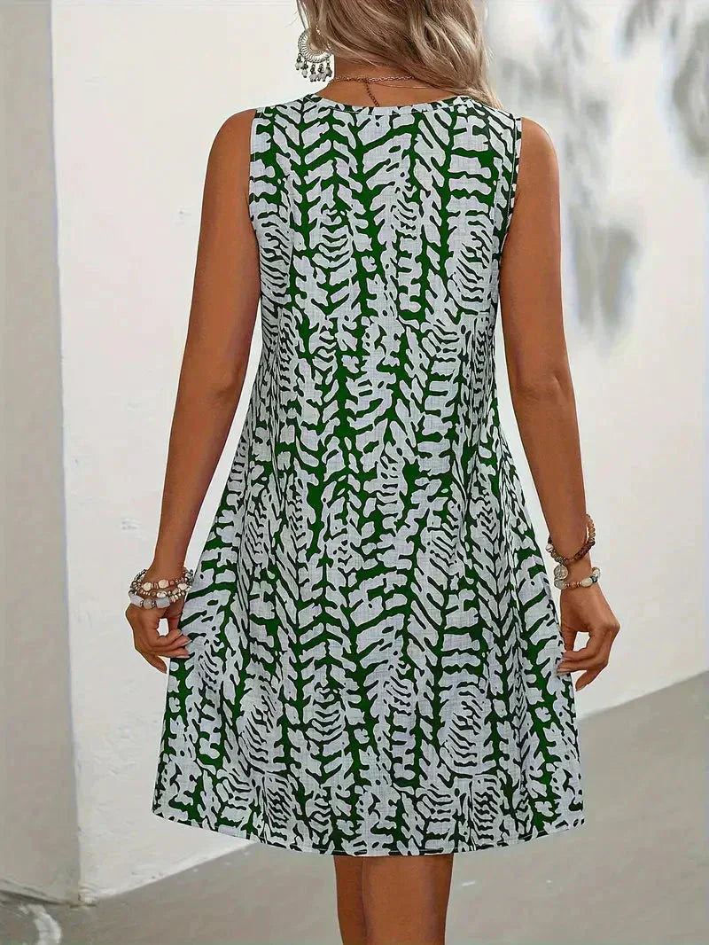"Robe mini imprimée légère d'été sans manches, motif vibrant, tissu respirant pour un style estival frais et confortable."