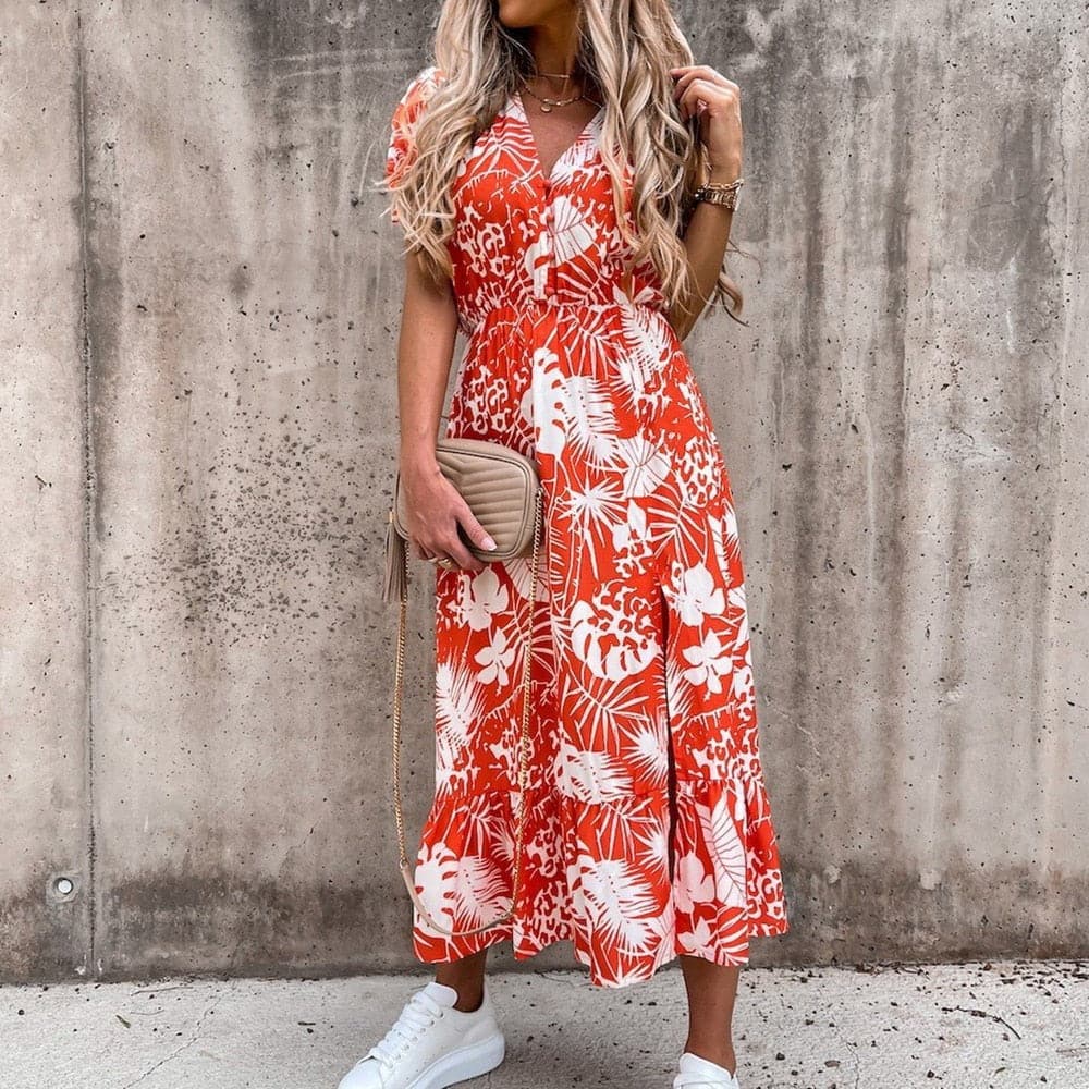 "Robe portefeuille tropicale midi avec motif vif, décolleté en V, manches courtes, ceinture ajustable et tissu léger."