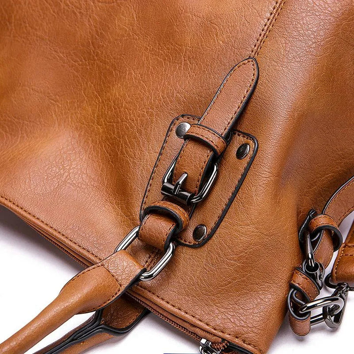 Sac à bandoulière en cuir véritable brun, élégant et résistant, avec sangle réglable pour un style chic et durable.