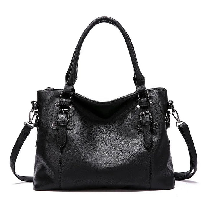 Sac à bandoulière en cuir véritable brun, élégant et résistant, avec sangle réglable pour un style chic et durable.