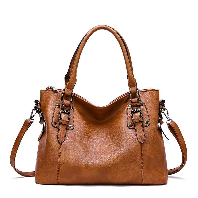 Sac à bandoulière en cuir véritable brun, élégant et résistant, avec sangle réglable pour un style chic et durable.