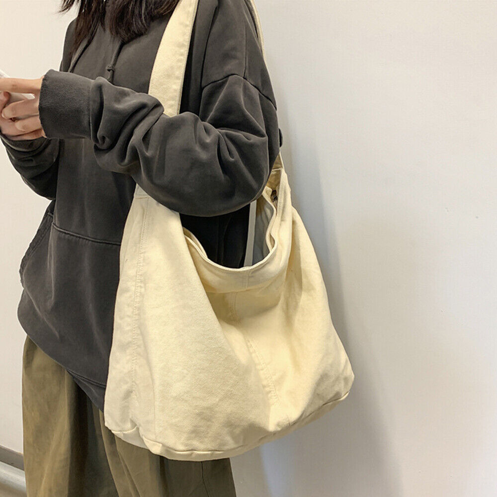 Sac à bandoulière toile spacieux, design minimaliste, bandoulière réglable, idéal pour usage quotidien ou professionnel.
