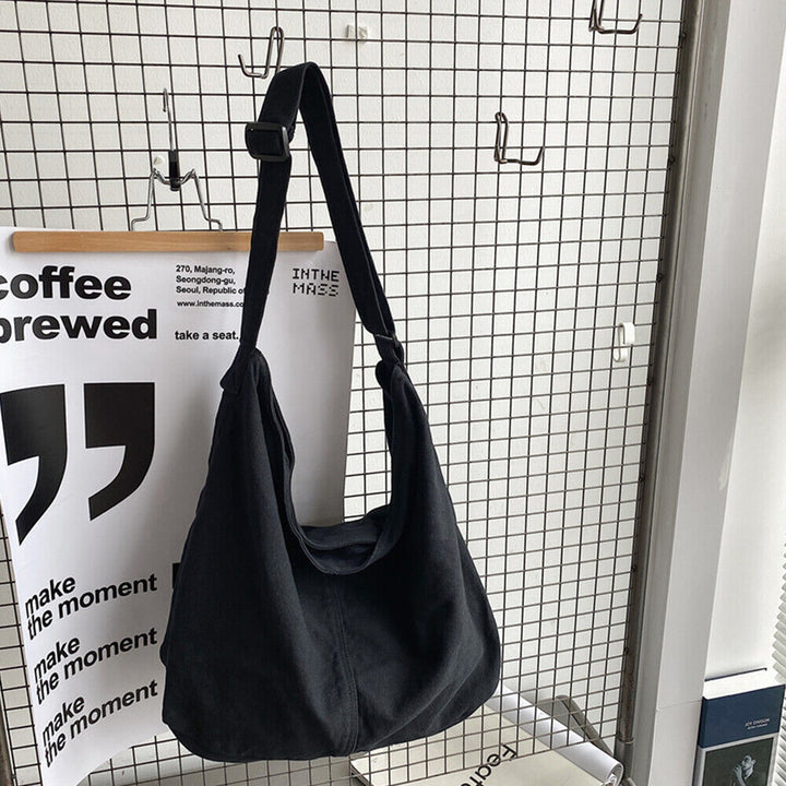 Sac à bandoulière toile spacieux, design minimaliste, bandoulière réglable, idéal pour usage quotidien ou professionnel.