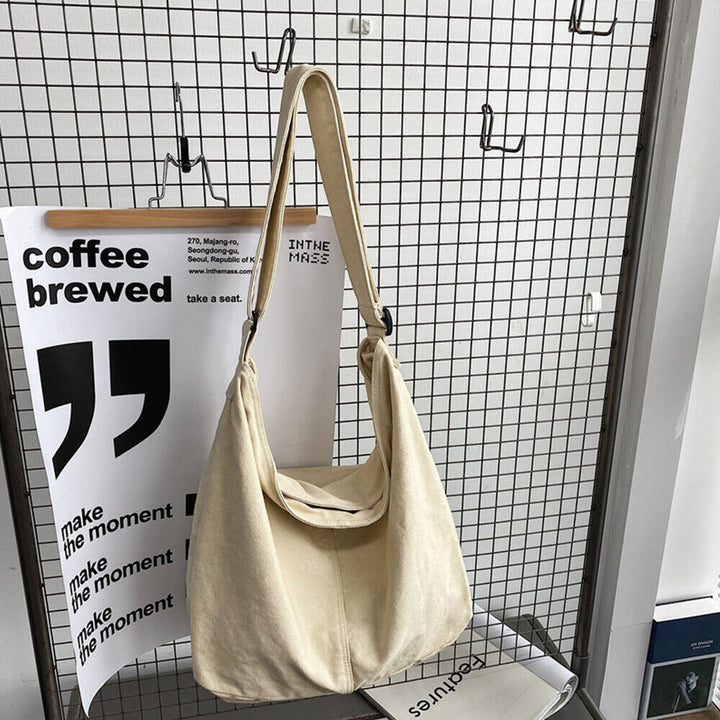 Sac à bandoulière toile spacieux, design minimaliste, bandoulière réglable, idéal pour usage quotidien ou professionnel.
