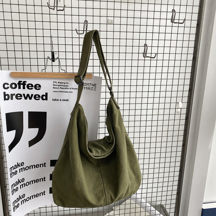 Sac à bandoulière toile spacieux, design minimaliste, bandoulière réglable, idéal pour usage quotidien ou professionnel.