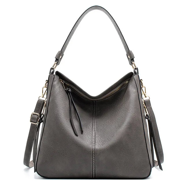 "Sac à main Hobo en cuir pour femme, design spacieux et lignes douces, couleur élégante, chic et fonctionnel."