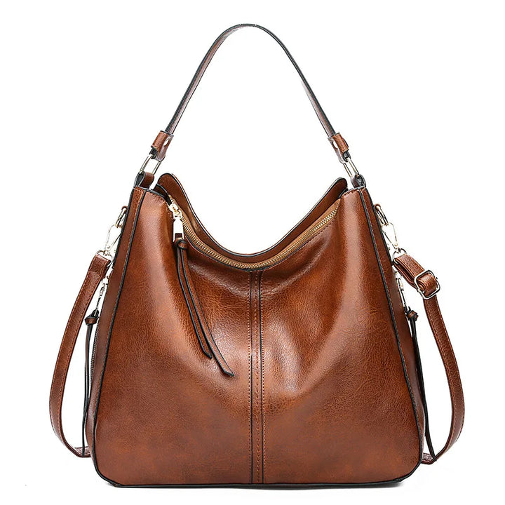 "Sac à main Hobo en cuir pour femme, design spacieux et lignes douces, couleur élégante, chic et fonctionnel."