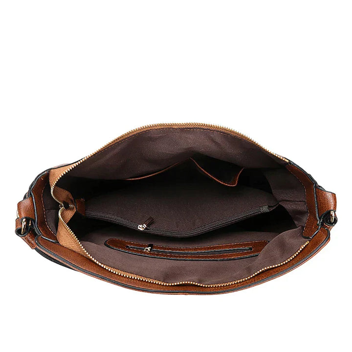 "Sac à main Hobo en cuir pour femme, design spacieux et lignes douces, couleur élégante, chic et fonctionnel."
