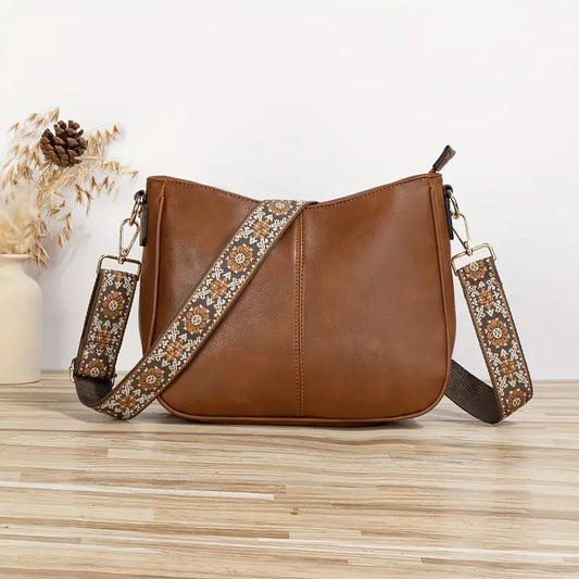 "Sac bandoulière en cuir végétalien Katelijne chic avec accents dorés, bandoulière ajustable et compartiments pratiques."