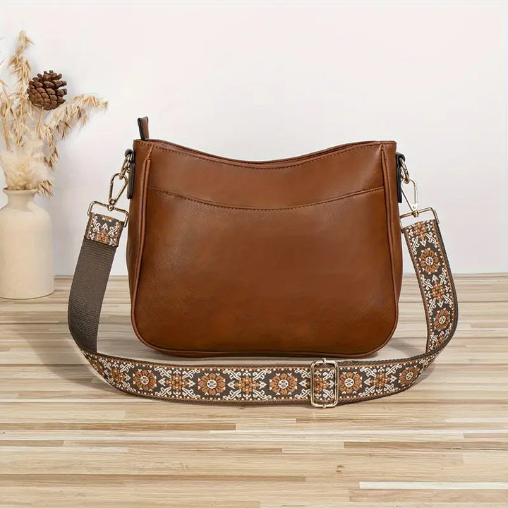"Sac bandoulière en cuir végétalien Katelijne chic avec accents dorés, bandoulière ajustable et compartiments pratiques."