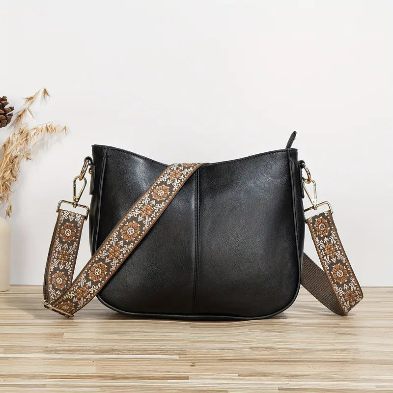 "Sac bandoulière en cuir végétalien Katelijne chic avec accents dorés, bandoulière ajustable et compartiments pratiques."