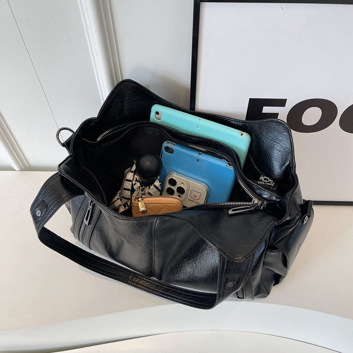 "Sac bandoulière femme Dakota en cuir synthétique, élégant, spacieux, bandoulière ajustable, vue de face, chic minimaliste"