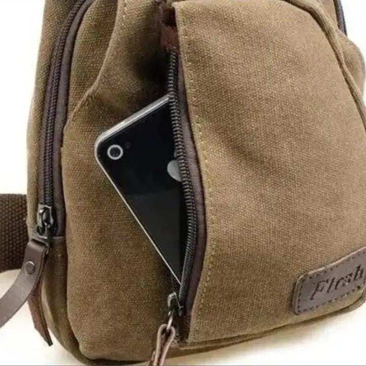 "Sac bandoulière robuste en toile ajustable, design élégant et confort optimal pour activités extérieures et urbaines."