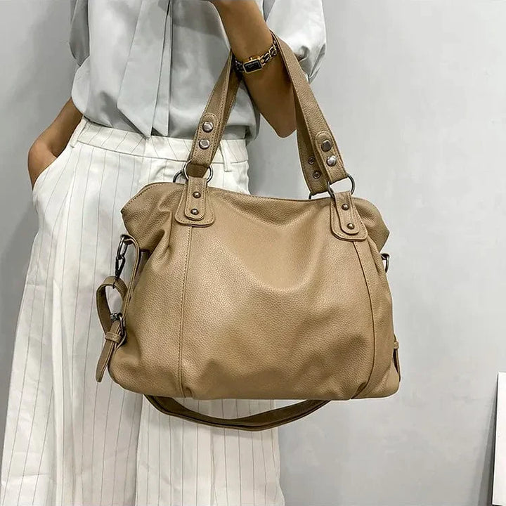 "Sac cabas en cuir PU souple noir, élégant et spacieux, avec fermeture zippée et bandoulière pour un style pratique."