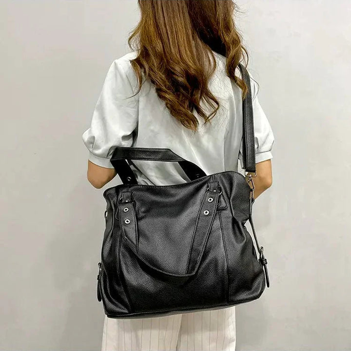 "Sac cabas en cuir PU souple noir, élégant et spacieux, avec fermeture zippée et bandoulière pour un style pratique."
