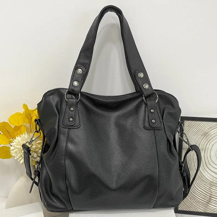 "Sac cabas en cuir PU souple noir, élégant et spacieux, avec fermeture zippée et bandoulière pour un style pratique."