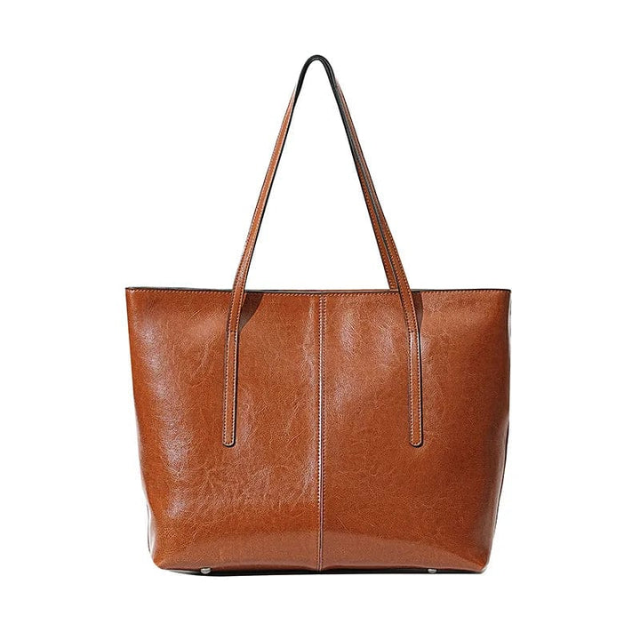 Sac cabas ordinateur femme marron en cuir véritable, moderne, robuste et élégant, parfait pour le travail ou les études.