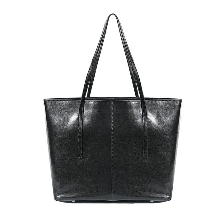 Sac cabas ordinateur femme marron en cuir véritable, moderne, robuste et élégant, parfait pour le travail ou les études.