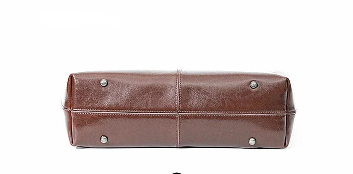 Sac cabas ordinateur femme marron en cuir véritable, moderne, robuste et élégant, parfait pour le travail ou les études.