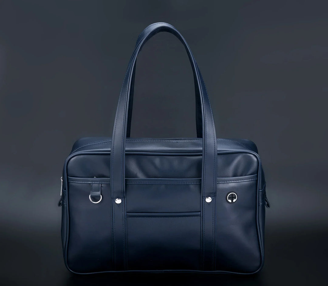 Sac cabas stylé pour lycéennes, cuir PU noir, spacieux, avec compartiment ordinateur portable et poches pratiques.