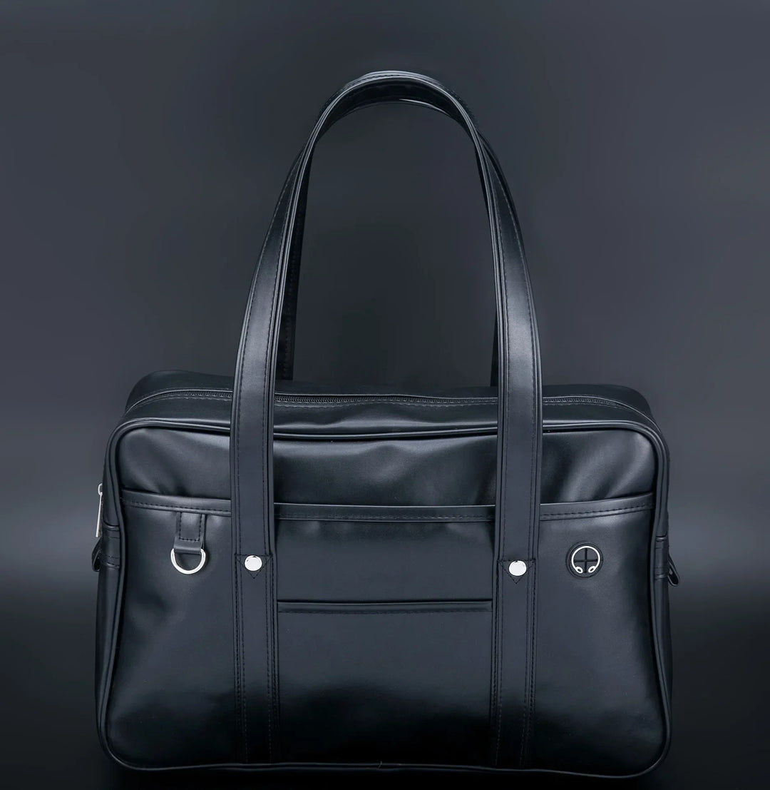 Sac cabas stylé pour lycéennes, cuir PU noir, spacieux, avec compartiment ordinateur portable et poches pratiques.