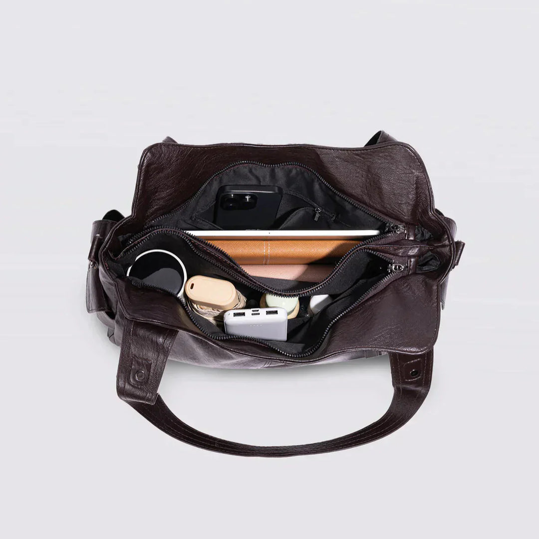 Sac d'école à bandoulière en cuir végétal lisse, design élégant, couleur classique, idéal pour femmes modernes.