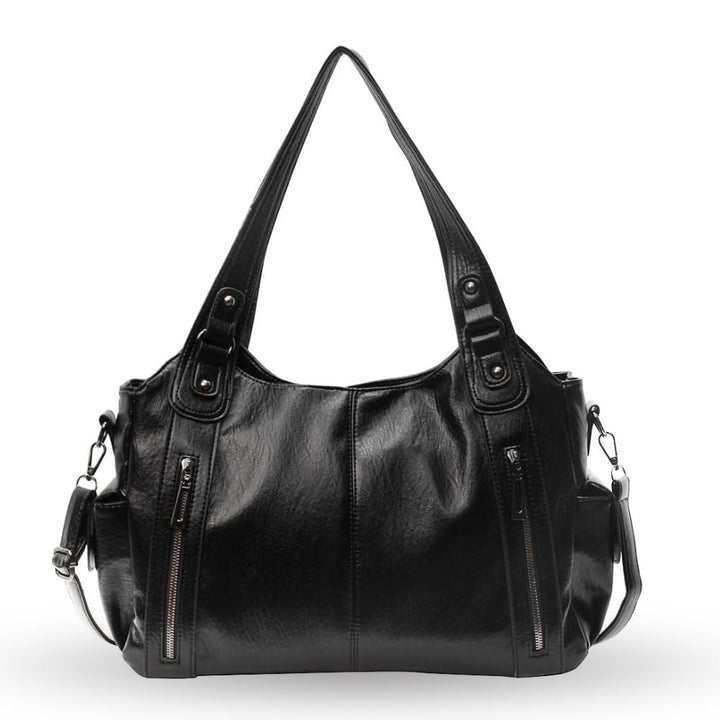 Sac d'école à bandoulière en cuir végétal lisse, design élégant, couleur classique, idéal pour femmes modernes.