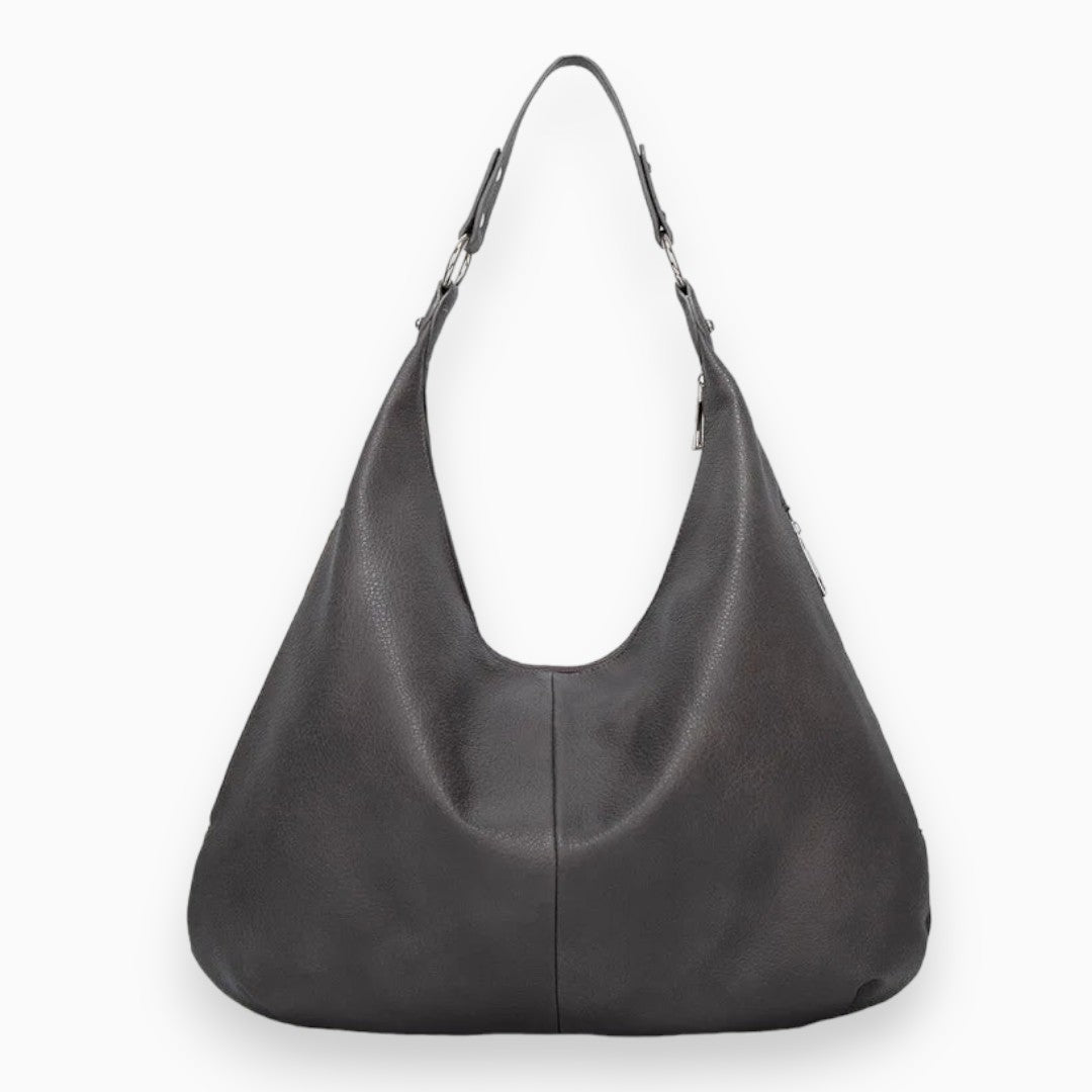 Sac hobo chic et spacieux en cuir camel, design souple et moderne, idéal pour accessoires femmes urbaines et élégantes.