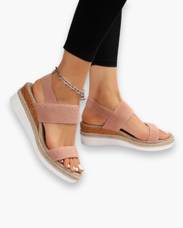 Sandales compensées élégantes pour femme, semelle haute et bride élastique, style chic idéal pour tenues estivales.