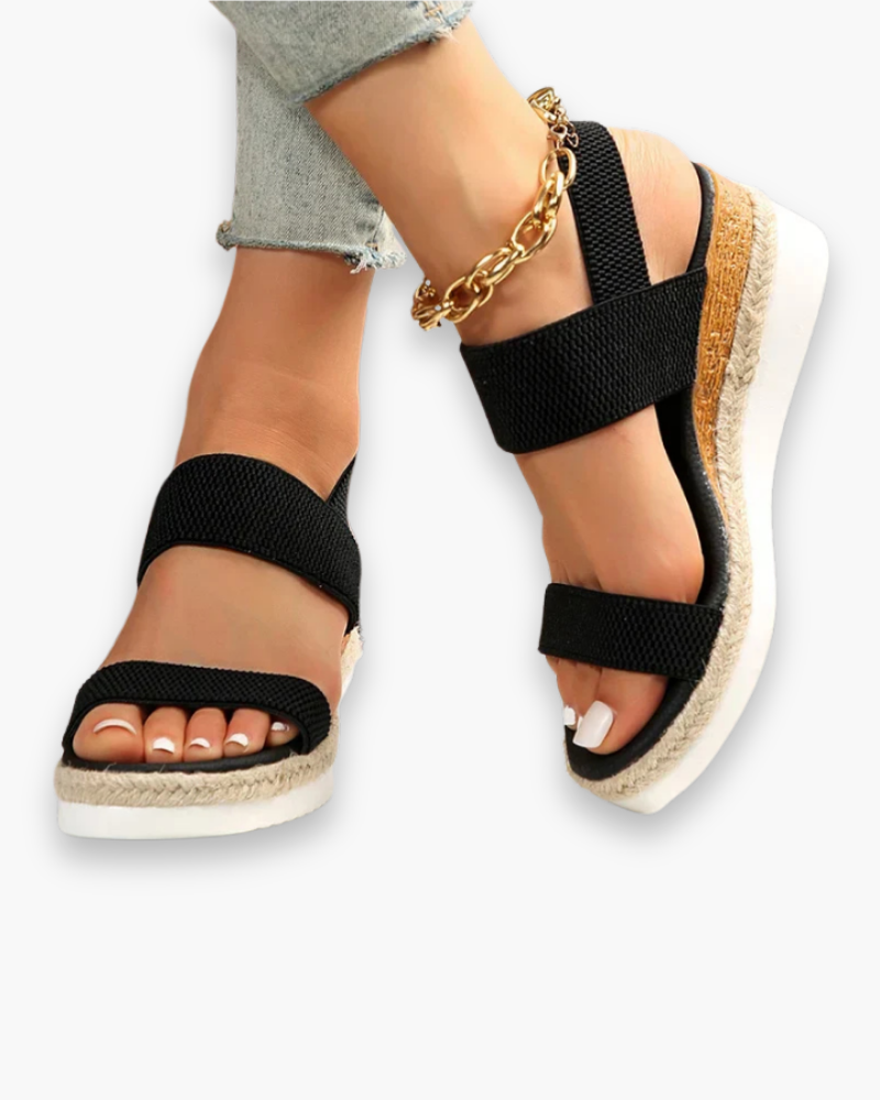 Sandales compensées élégantes pour femme, semelle haute et bride élastique, style chic idéal pour tenues estivales.