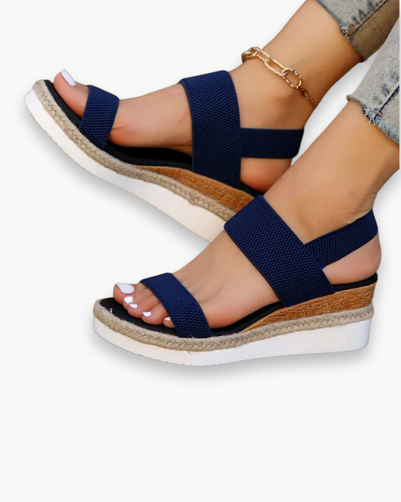 Sandales compensées élégantes pour femme, semelle haute et bride élastique, style chic idéal pour tenues estivales.