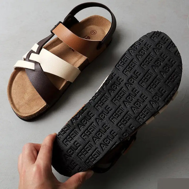 "Sandales en cuir chic et confortables avec semelle ortho-coussinée, disponibles en plusieurs couleurs pour homme et femme."