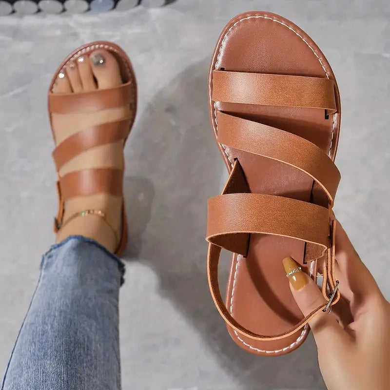 "Sandales plates Dahlia ivoire, design romain à lanières cheville, élégantes et confortables pour femmes, mode estivale."