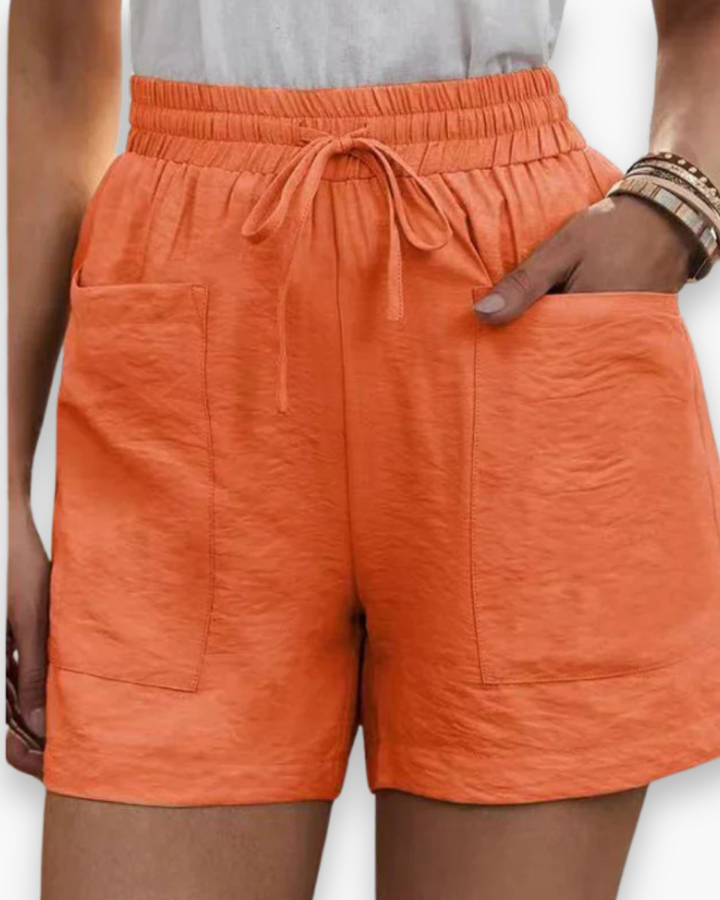 Short cargo femme été, tissu respirant léger, poches latérales, ceinture ajustable, confort et style décontracté.