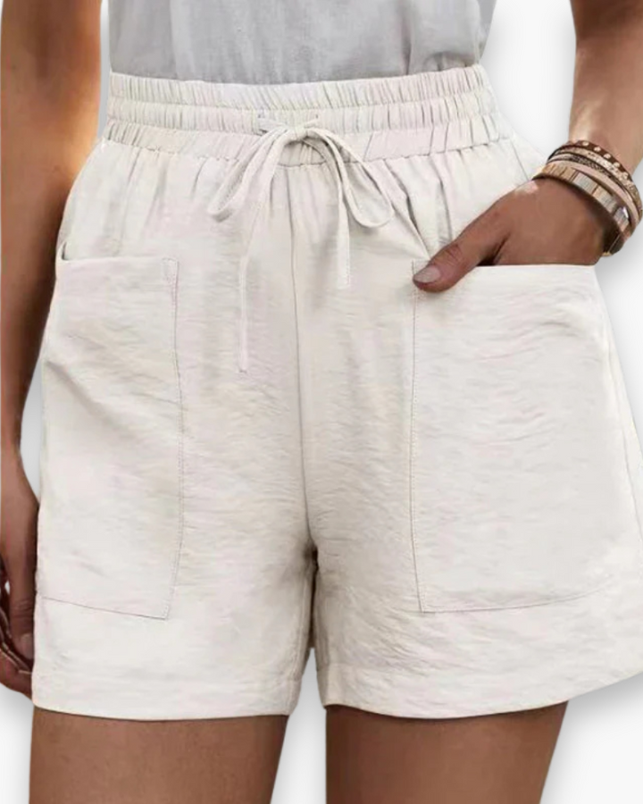 Short cargo femme été, tissu respirant léger, poches latérales, ceinture ajustable, confort et style décontracté.