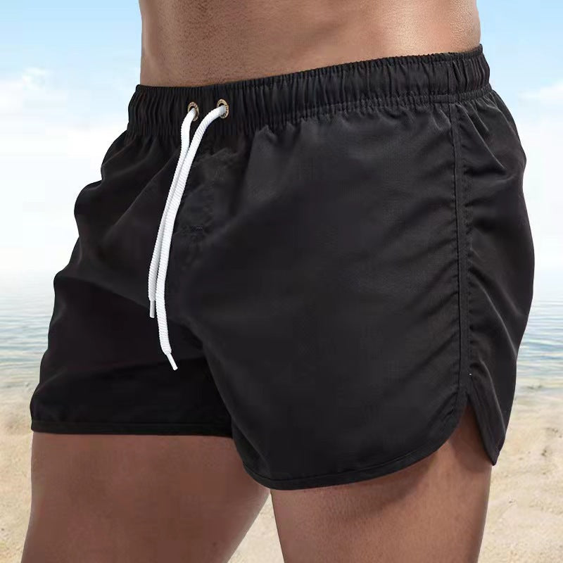 Short de bain homme bleu, tissu extensible, séchage rapide, vue avant, élégant et confortable pour plage ou piscine.