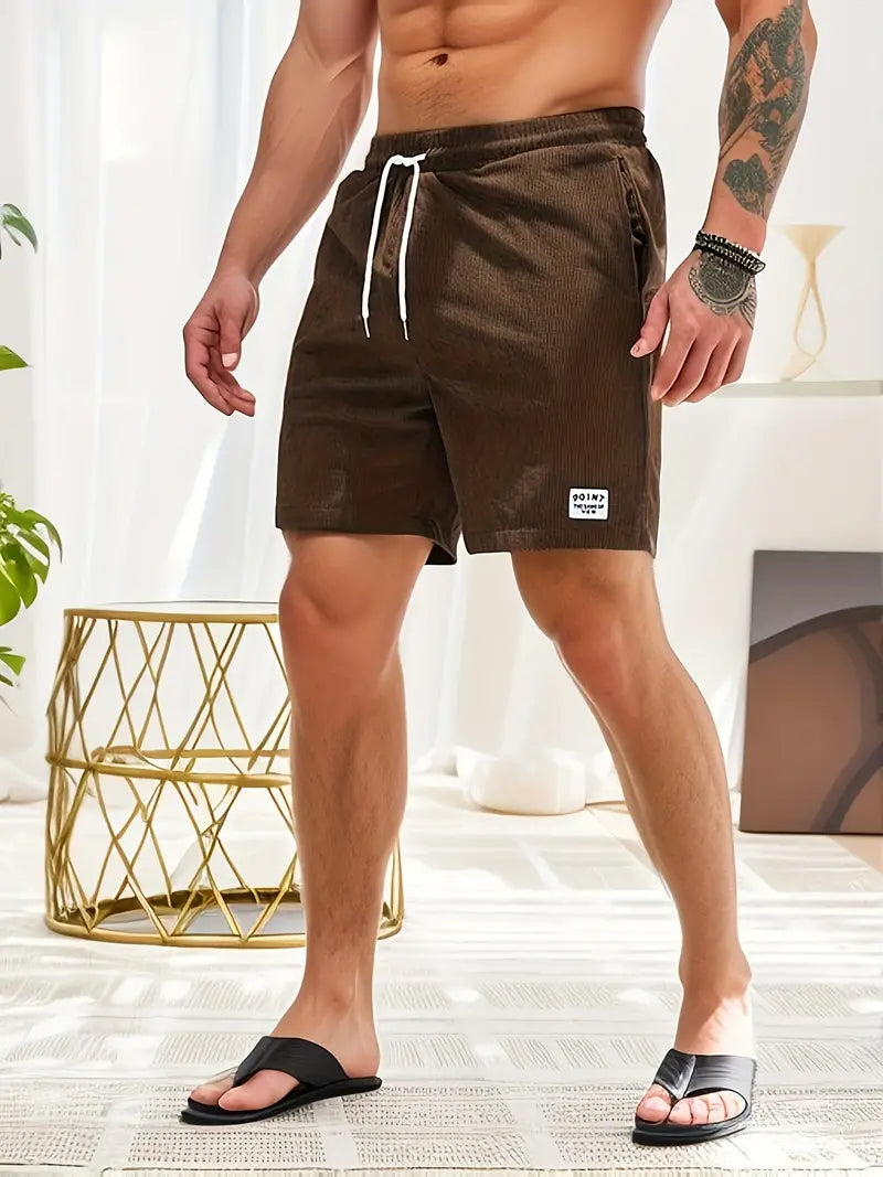 Short de bain homme coloré avec taille élastique et cordon, parfait pour la plage ou piscine, séchage rapide et élégant.