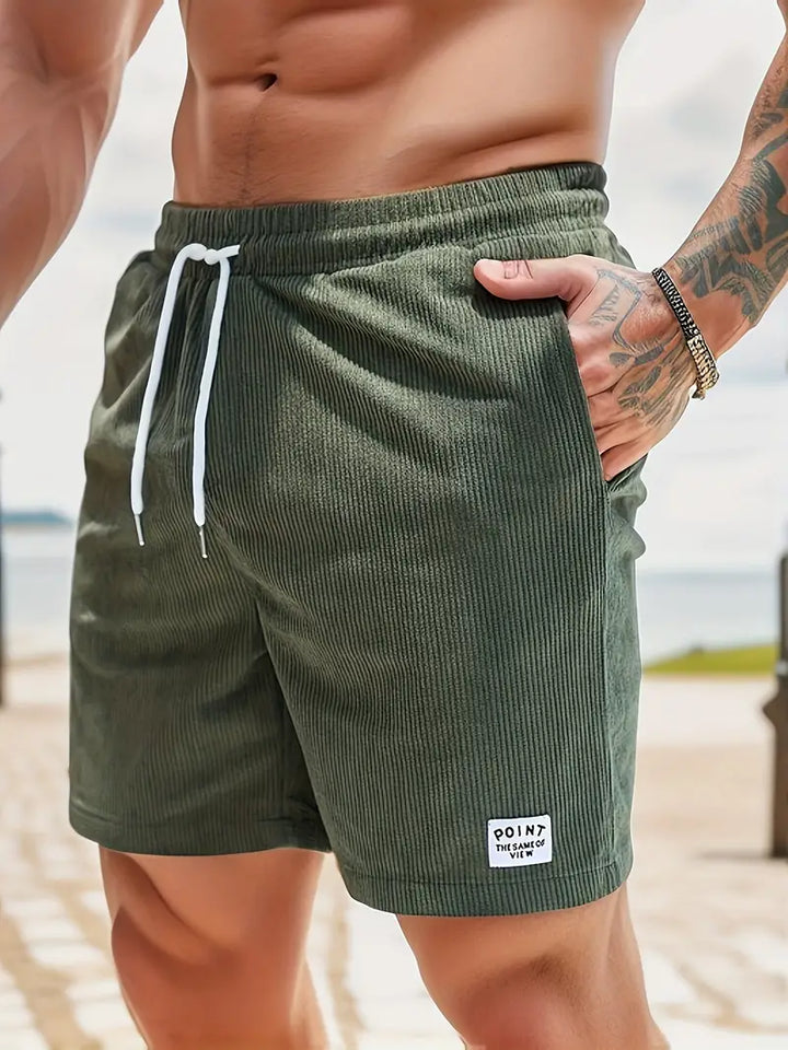 Short de bain homme coloré avec taille élastique et cordon, parfait pour la plage ou piscine, séchage rapide et élégant.